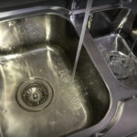 two sinks filling with water